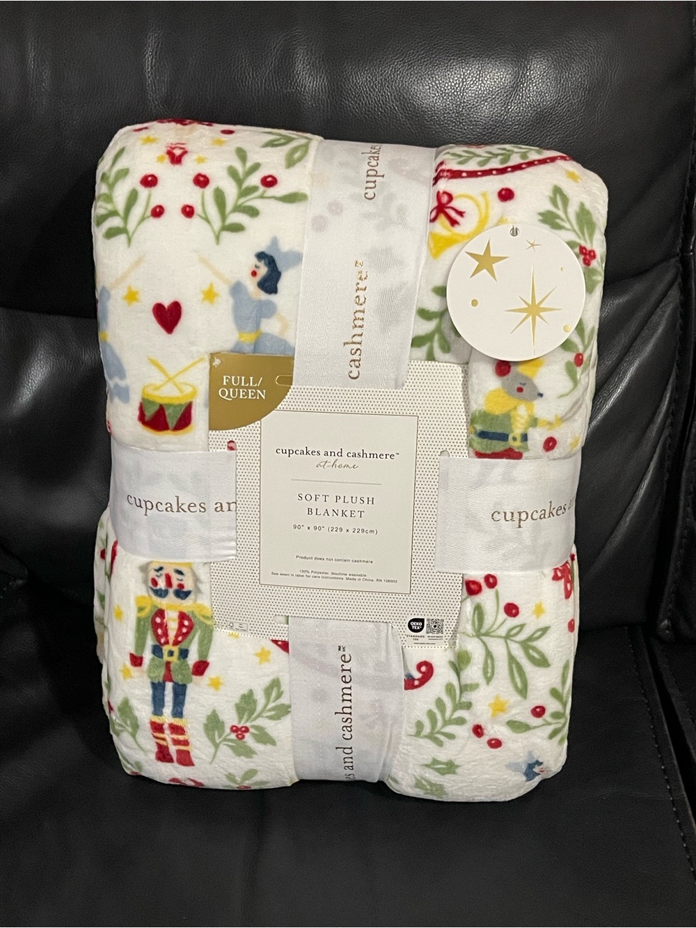 cupcakes & cashmere Holiday Nutcracker Plush Blanket in White, Red, Green